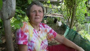 Anne Wensley in her Deep Litter Chicken Coop